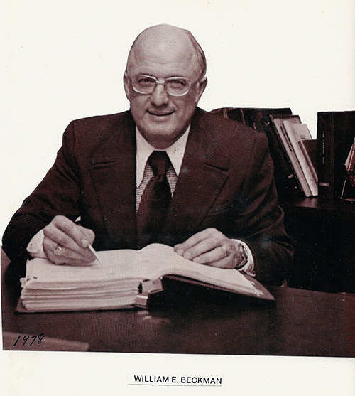 image of William E Beckman at his desk